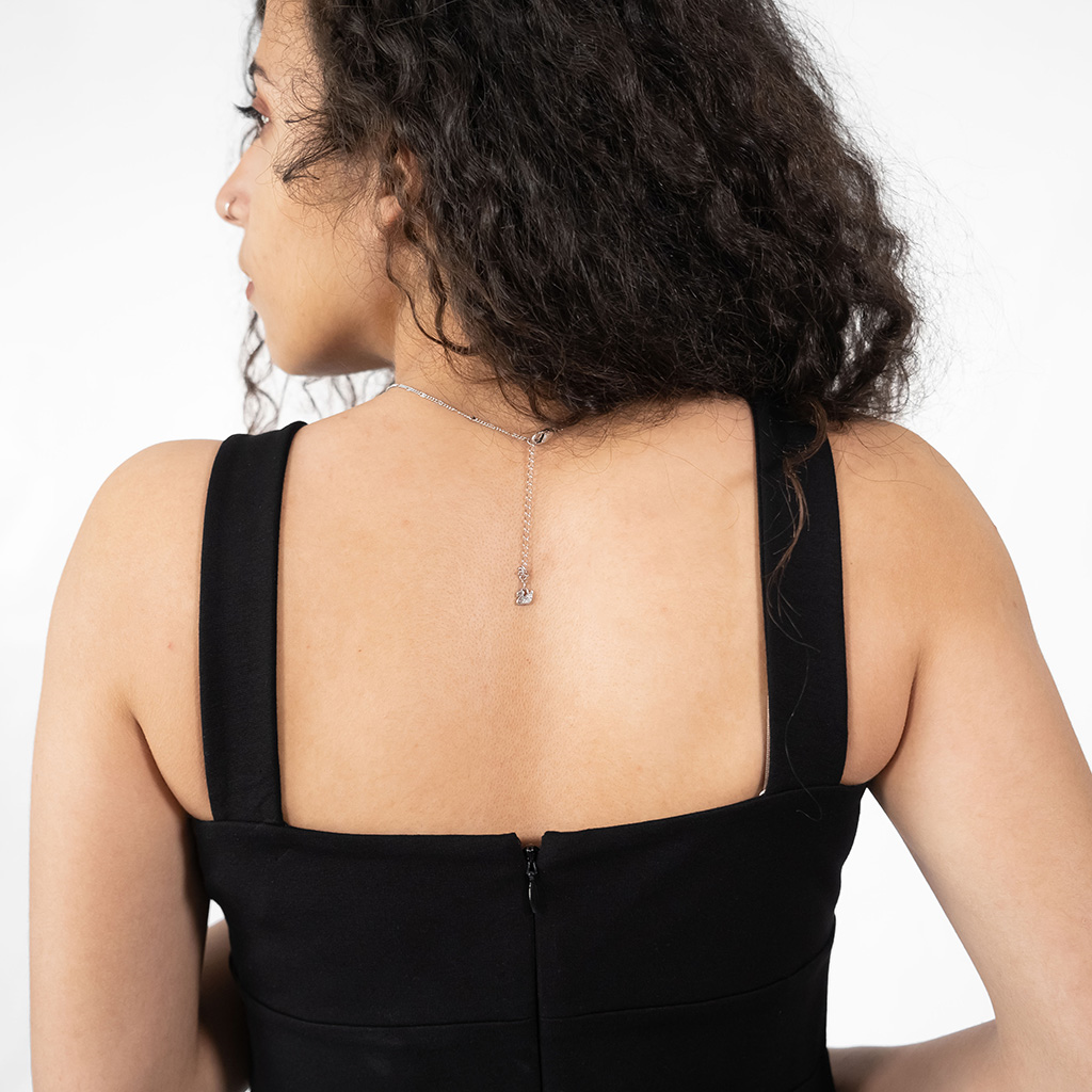 Dress decorated with a buckle