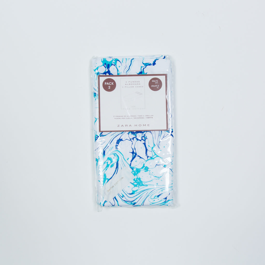 Face and two bed pillows